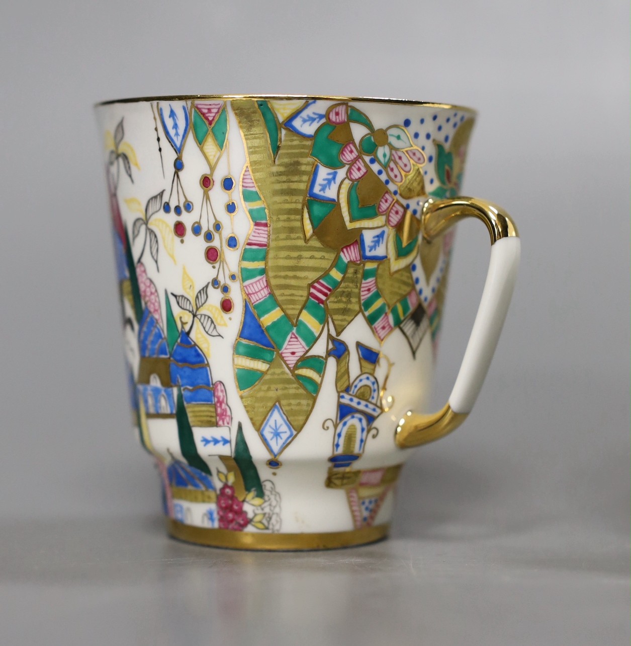 A Russian gilt enamel porcelain tea cup and saucer, cup 8cms high